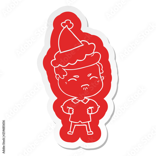 cartoon sticker of a annoyed man wearing santa hat