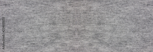 Grey fabric texture background elongated banner of empty silky smooth cloth material. Blank wide mock up of light gray color