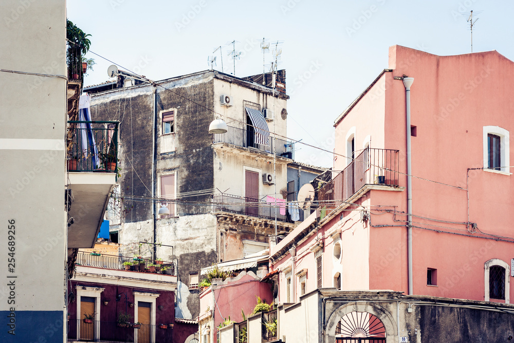 Fototapeta premium Beautiful cityscape of Italy, historical street of Catania, Sicily, facade of old buildings.
