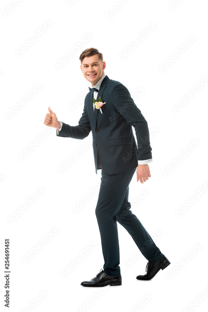 cheerful bridegroom in black suit showing thumb up isolated on white cheerful bridegroom in black suit showing thumb up isolated on white