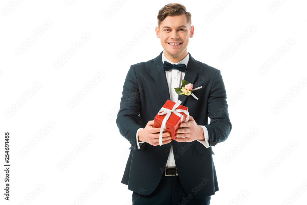 happy bridegroom holding red gift box isolated on white happy bridegroom holding red gift box isolated on white