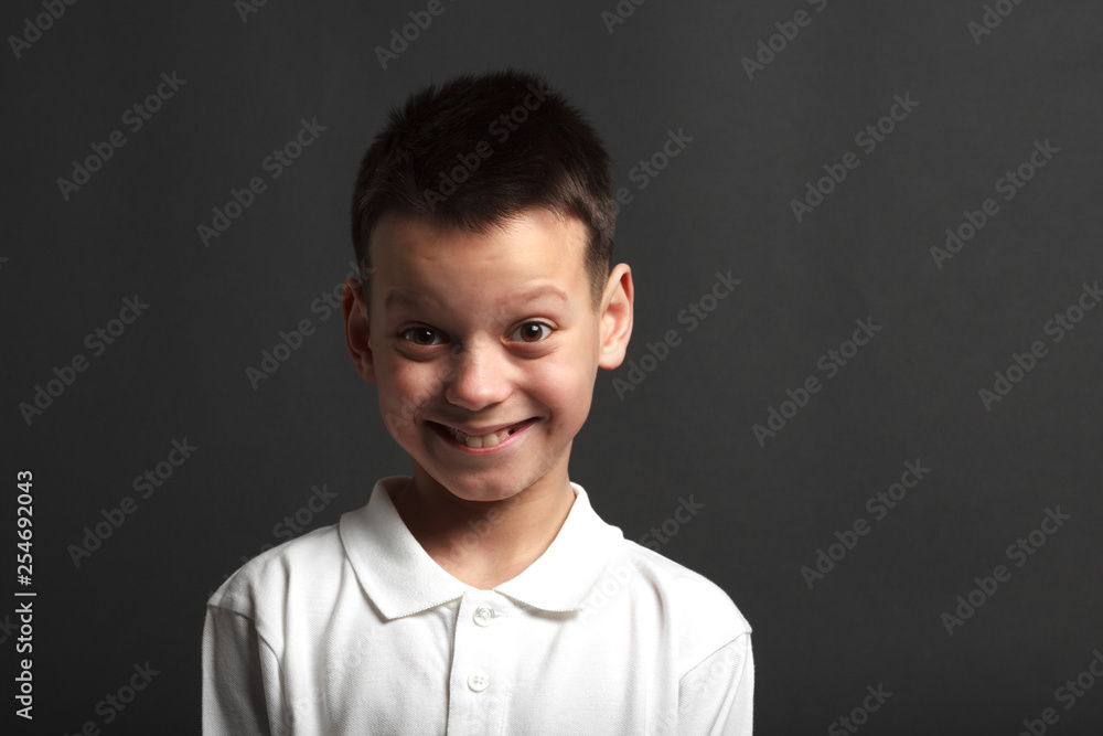 Fototapeta premium a model boy posing on gray background