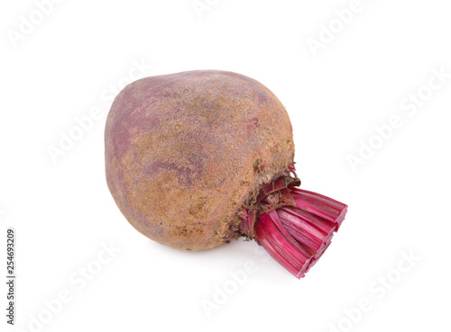 uncooked whole ripe beetroot with stem on white background