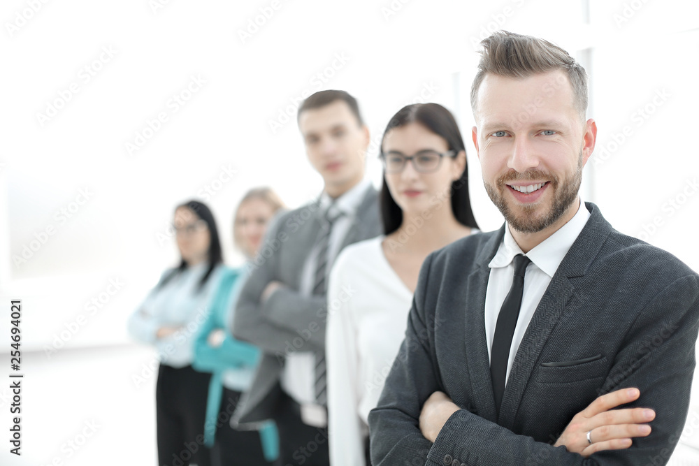 confident businessman standing in front of his business team confident businessman standing in front of his business team