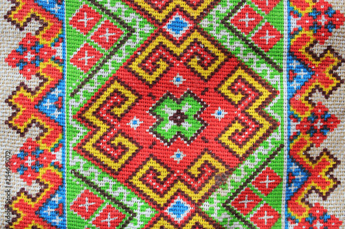 folk textile ornament consisting of patterns of geometric shapes and lines