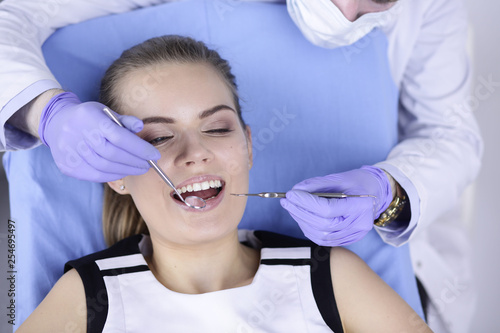 beautiful girl in the dental chair on the examination at the dentist