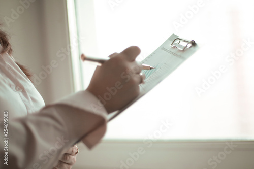 close up. business woman checking financial data.