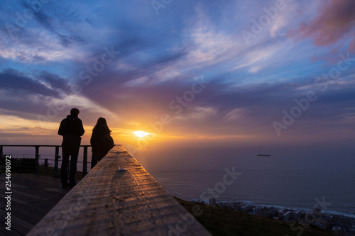 Selective focus  Tourist is taking a picture of sunset at view point . capetown . south africa © morkdam