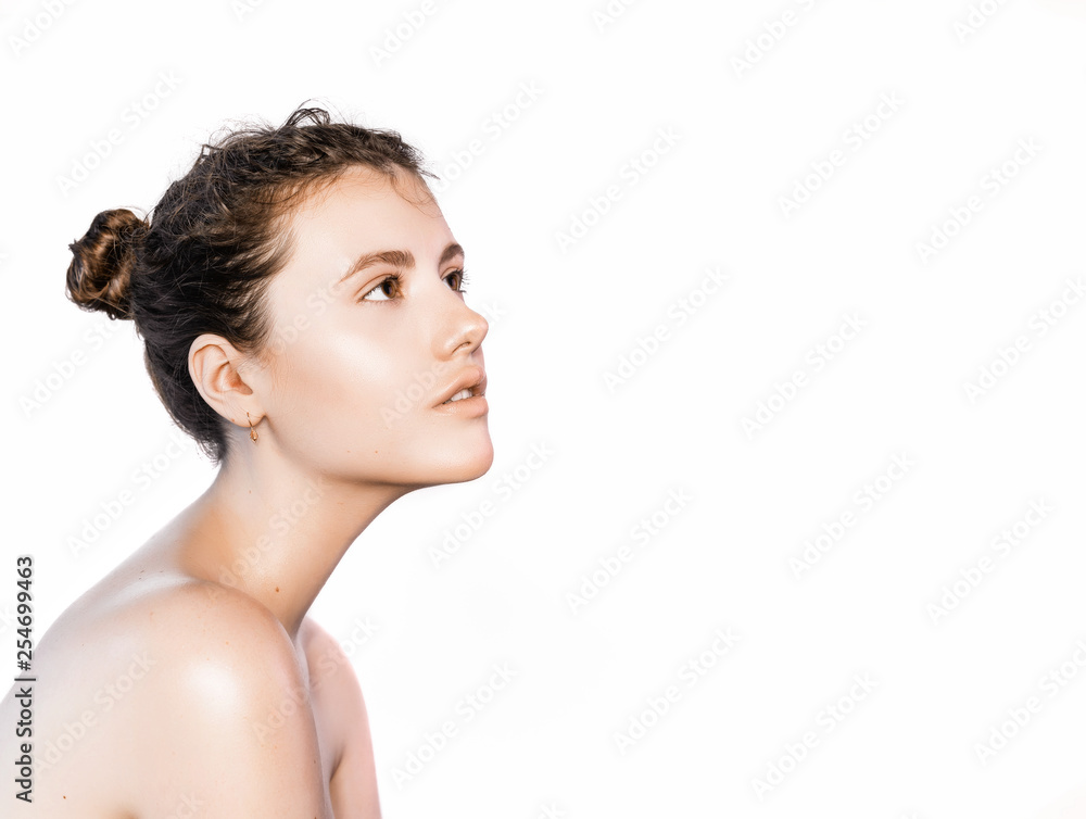 Side view portrait brunette woman with clean fresh skin. Facial treatment . Cosmetology , beauty and spa. Isolated on a white background Side view portrait brunette woman with clean fresh skin. Facial treatment . Cosmetology , beauty and spa. Isolated on a white background