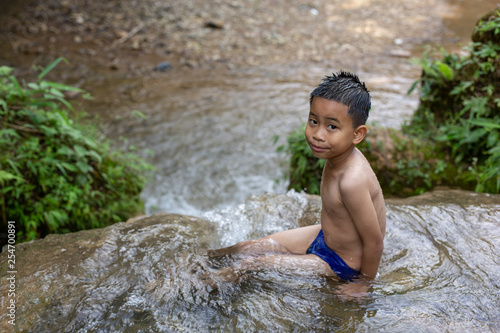 Children play happily in the stream.