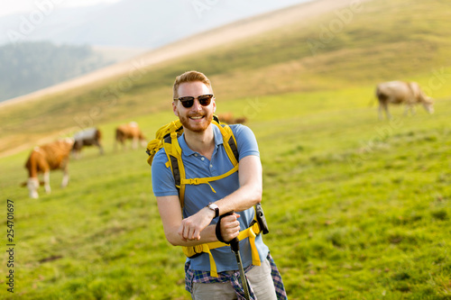 Handsome young red hair man hiking