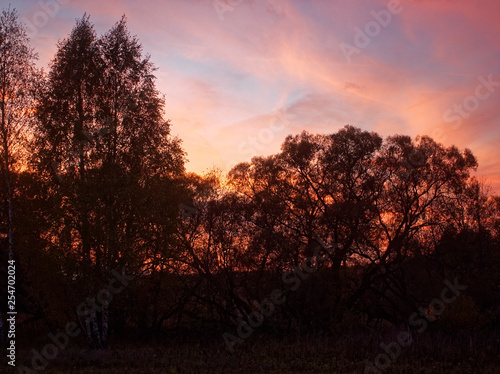 colorful sunset in the countryside in autumn