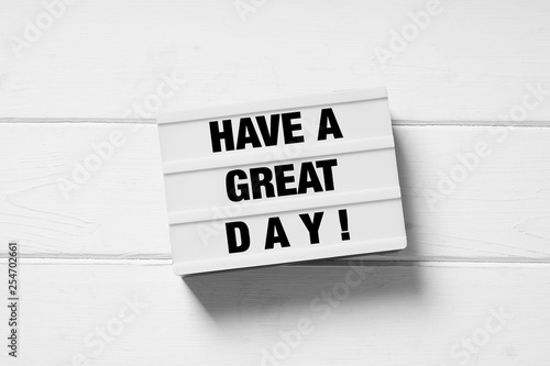 have a great day motivational text on light box light box sign on white wooden background