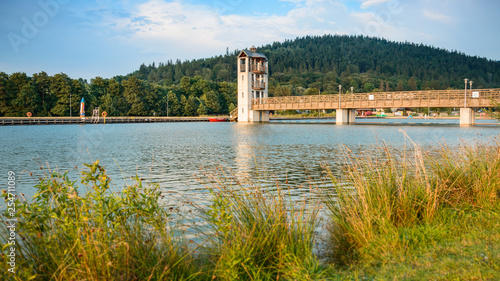 Fototapeta Naklejka Na Ścianę i Meble -  Stara Morawa, Observation tower by the lake among mountain peaks.