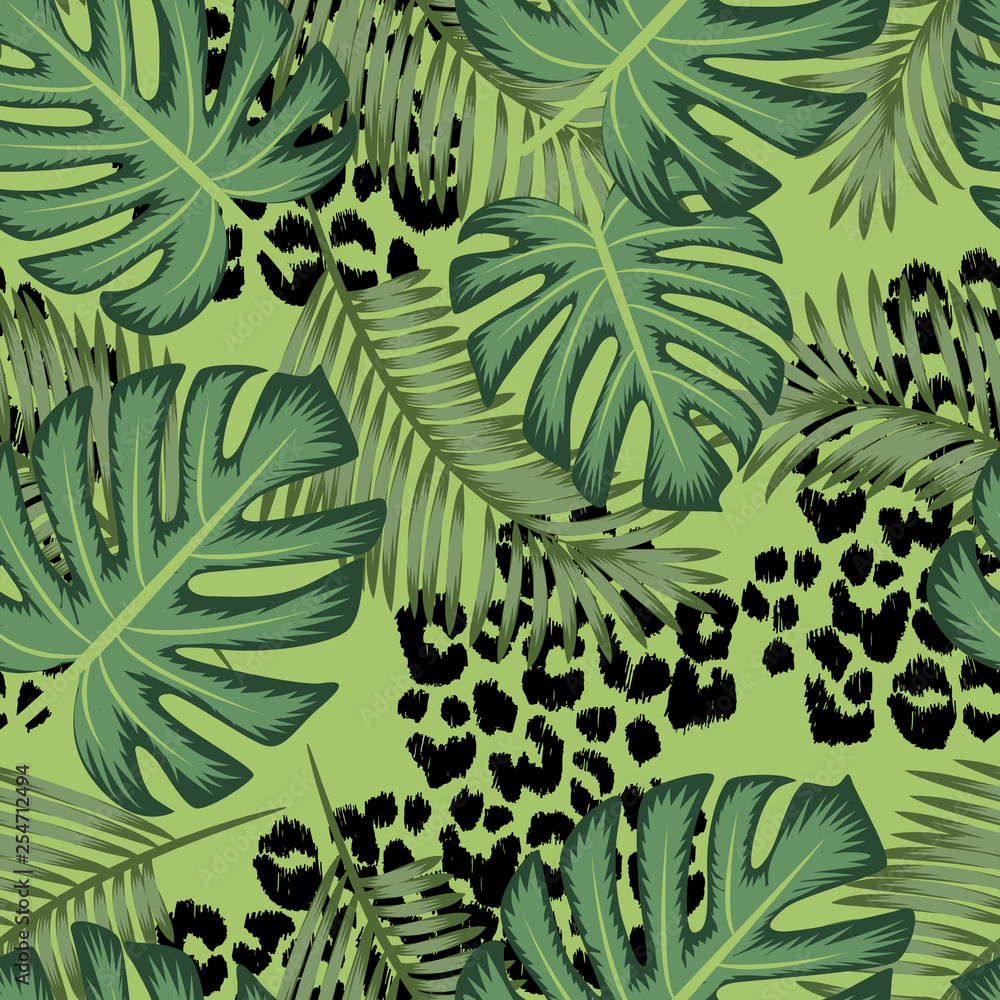 Vector seamless pattern with leopard texture and palm exotic leaves