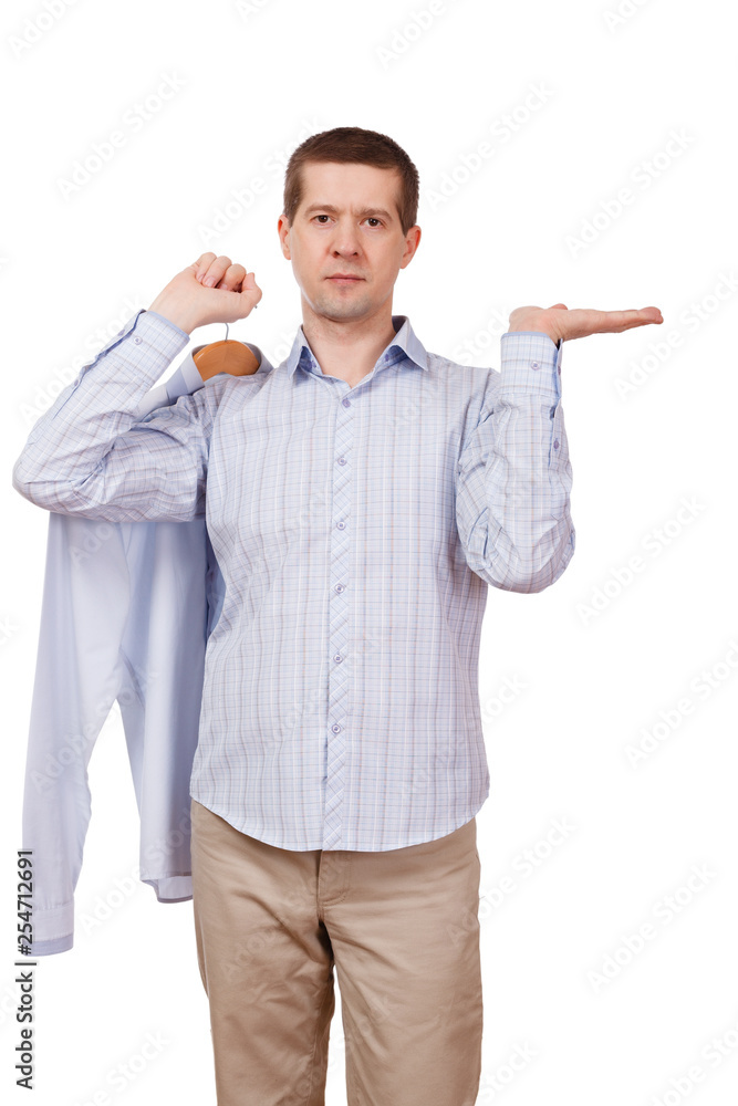 the man holds a palm horizontally, and a coat hanger with clothes in hands, on a white background the man holds a palm horizontally, and a coat hanger with clothes in hands, on a white background