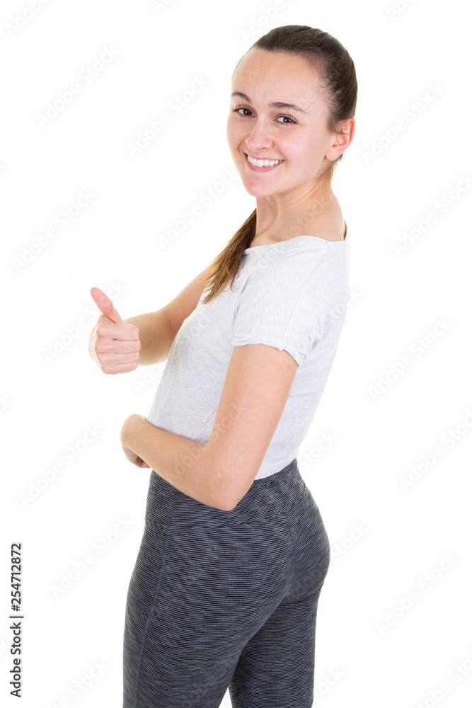 Beautiful young slim woman posing in Sport clothes Sensual Fitness Model with Perfect Body in Healthy lifestyle Diet with one thumb up Beautiful young slim woman posing in Sport clothes Sensual Fitness Model with Perfect Body in Healthy lifestyle Diet with one thumb up