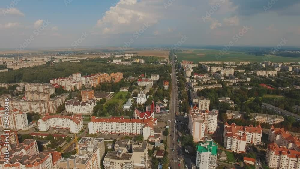 Aerial view of city life with colourful buildings and traffic. 4K