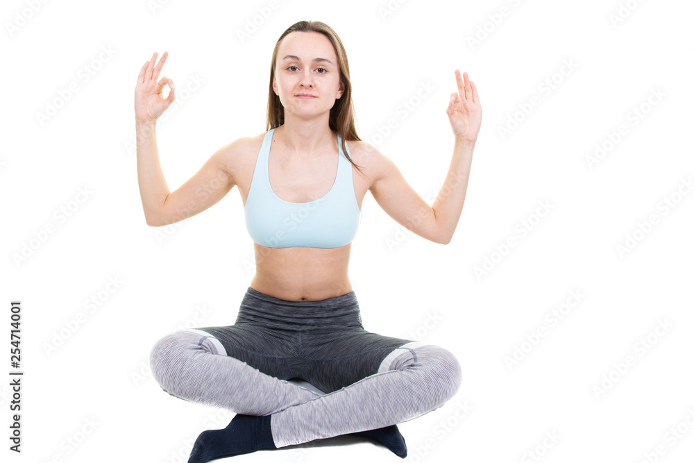 Young healthy woman doing yoga exercises isolated on white background Young healthy woman doing yoga exercises isolated on white background