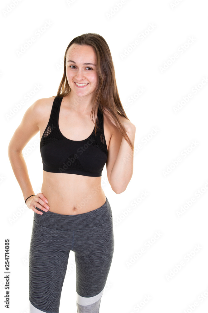 Attractive young adult woman in sportswear posing on white background Attractive young adult woman in sportswear posing on white background