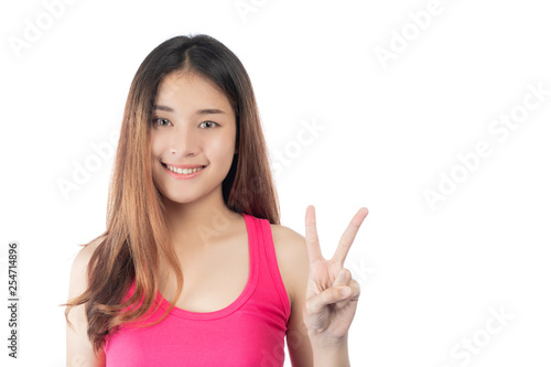 Beautiful woman wears a pink shirt with a smile showing her hand  isolated on white background.