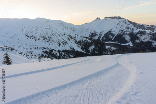 A trace of skis on snow against a background of mountains. Tatry.