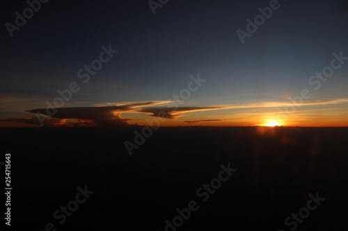 Horizon image that consists of the sun and clouds. © Achisatha