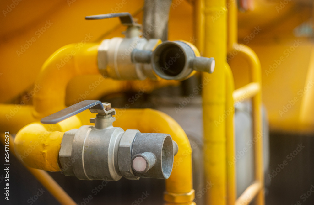 Close up for fireman hands in special gloves connecting fire hose with water tank.