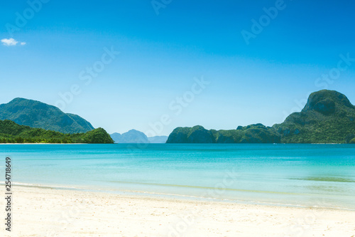 Fabulous exotic beach with white sand and high palm trees © fotomaximum