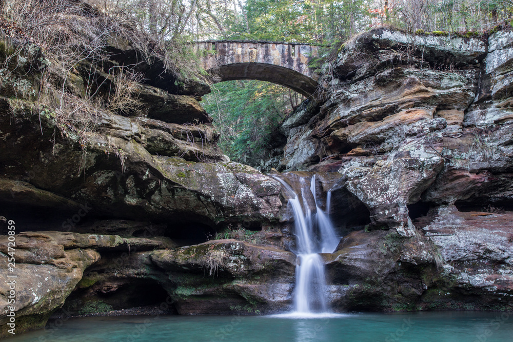Old Mans Cave Stone footbridge over a waterfall in the Old Mans Cave Old Mans Cave Stone footbridge over a waterfall in the Old Mans Cave