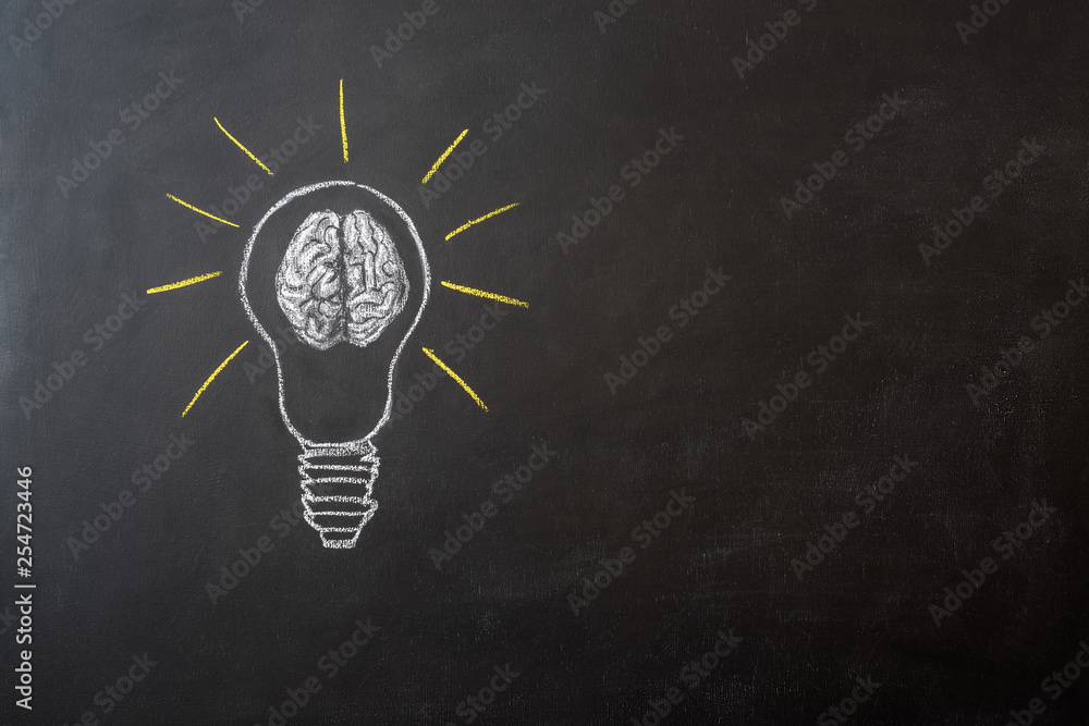 bulb with human brain on chalkboard with copy space