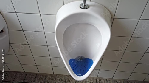 Close up of dirty urinal men public toilet