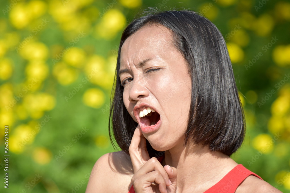 Youthful Filipina Female With Toothache Youthful Filipina Female With Toothache