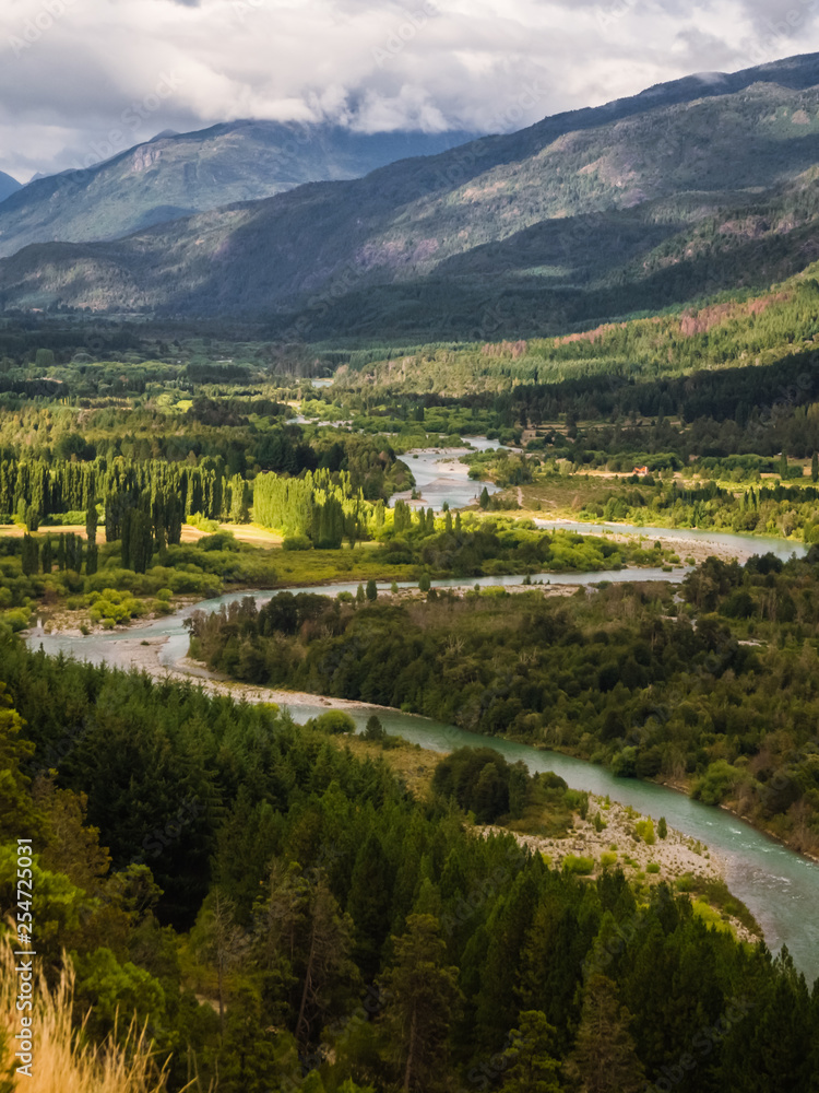 Landscape of Blue river, valley and forest in El Bolson, argentinian Patagonia