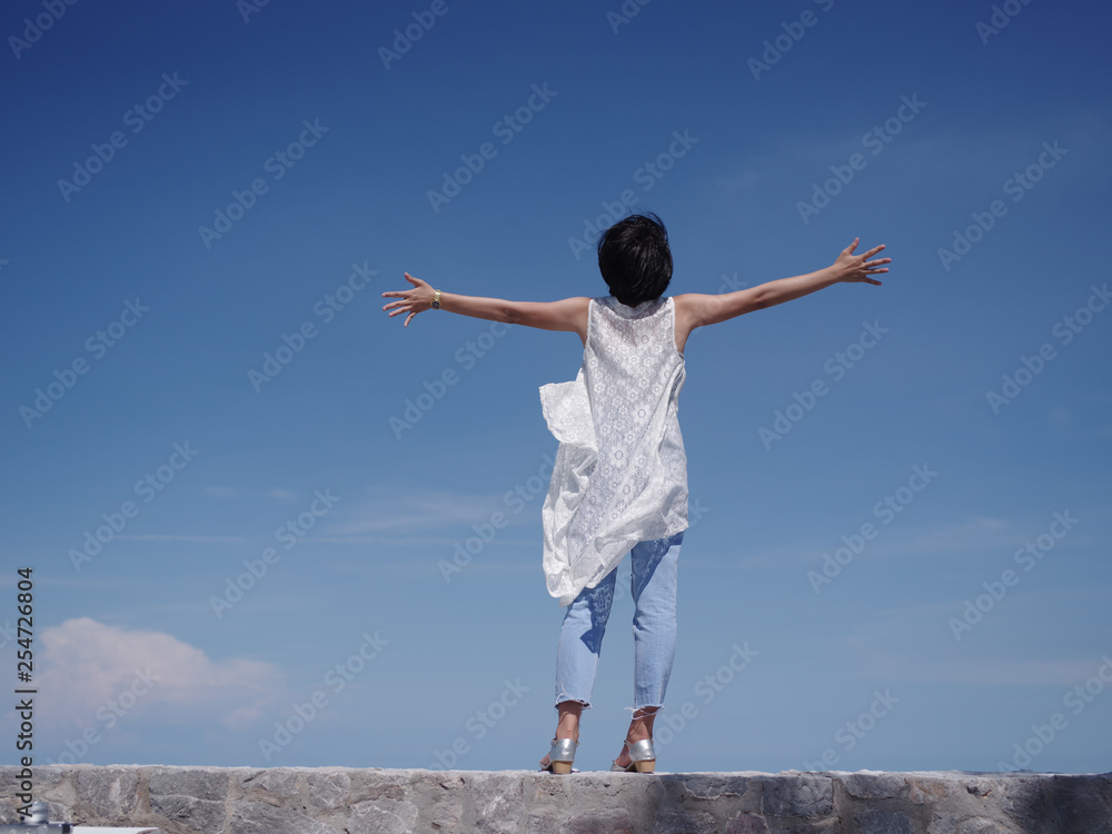 Asian woman happy and smile on the beach and blue sky Asian woman happy and smile on the beach and blue sky