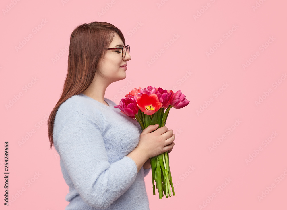 Loving woman with pink tulips Loving woman with pink tulips