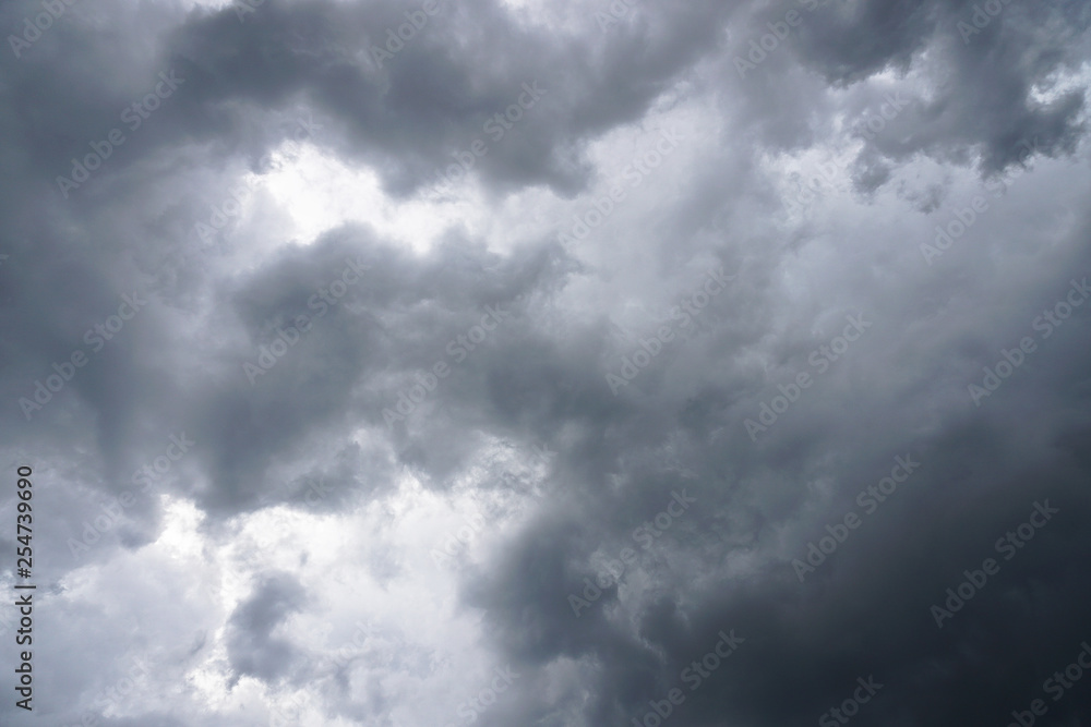 Dark, grim, stormy, rainy sky with rays of light. Scary hurricane clouds. Natural element. Stock Photo for your design Dark, grim, stormy, rainy sky with rays of light. Scary hurricane clouds. Natural element. Stock Photo for your design