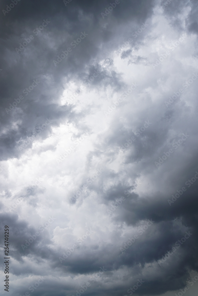 Dark, grim, stormy, rainy sky with rays of light. Scary hurricane clouds. Natural element. Stock Photo for your design Dark, grim, stormy, rainy sky with rays of light. Scary hurricane clouds. Natural element. Stock Photo for your design