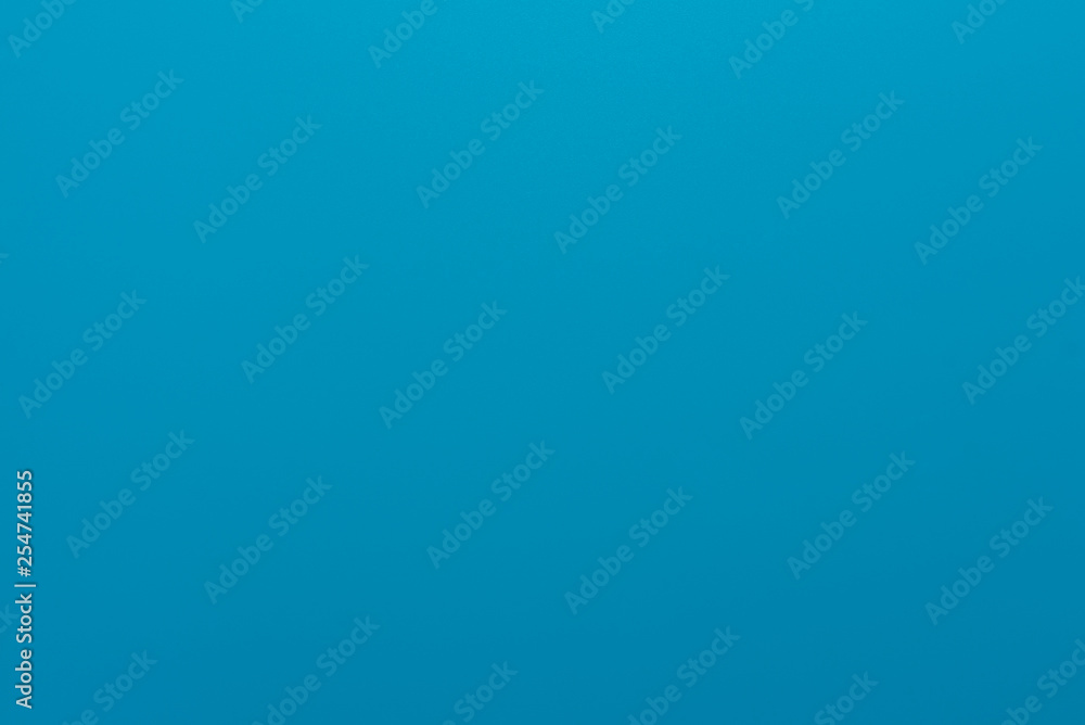 Texture in a bright, blue color illuminated with a delicate light. Texture in a bright, blue color illuminated with a delicate light.
