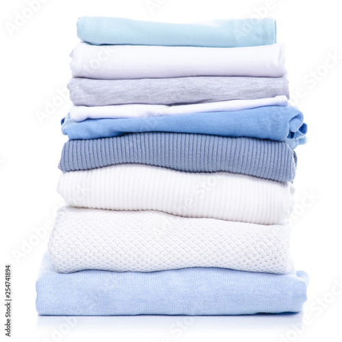 Stack blue white clothing sweater t-shirt on white background isolation
