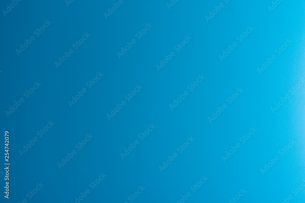 Texture in a bright, blue color illuminated with a delicate light.