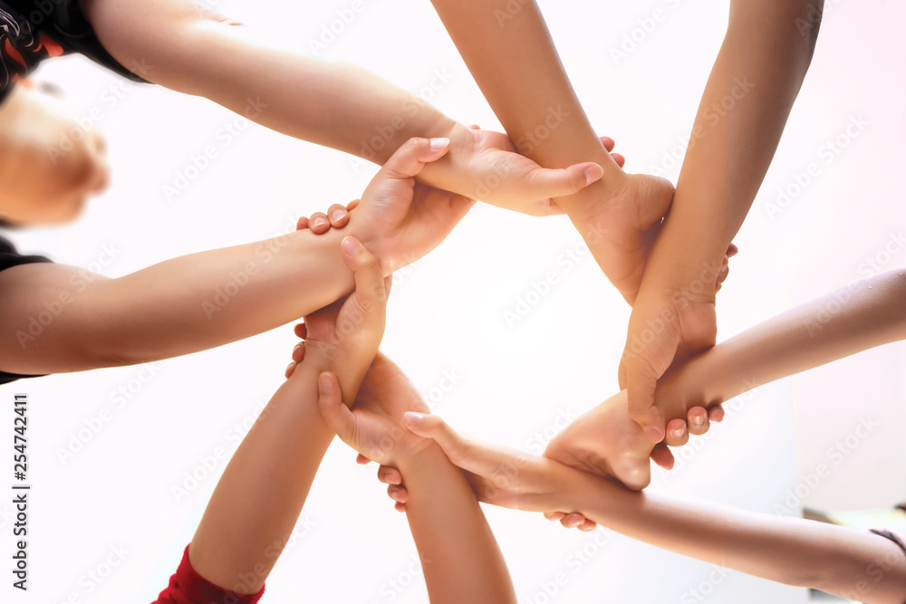 Young group are join hands for working the job success , Hands, symbolizing the hands to unity and teamwork ,success ,helps , business concept. 