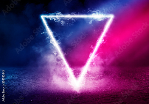 Neon triangle shape in smoke on a dark background. Background of empty room  with concrete floor, neon light Stock Photo | Adobe Stock
