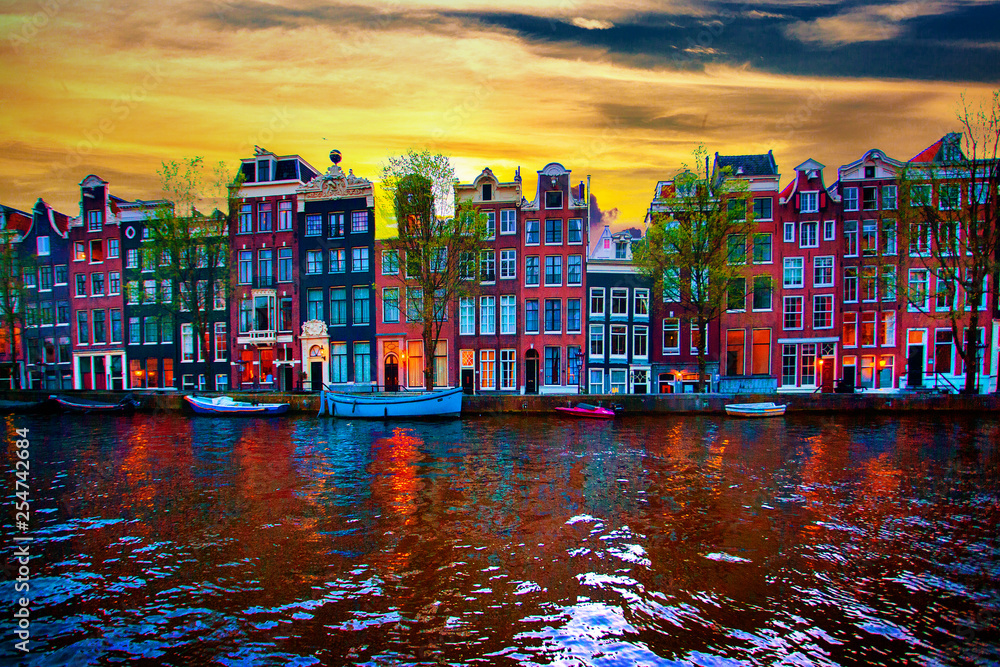 Amsterdam canal with typical dutch houses on sunrise, Holland, Netherlands.