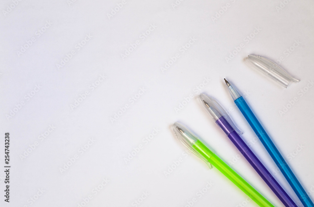 Colored pens on a white background. View from above. copy space