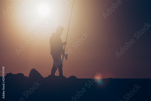 Fisherman fishing during hot summer day