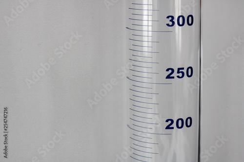 Obraz na plátně Chemical flask with milliliter marks close up