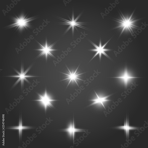 A set of bright beautiful stars. Light effect. Bright Star. Beautiful light for illustration. Christmas star.White sparkles shine special light effect. Vector sparkles on a transparent background