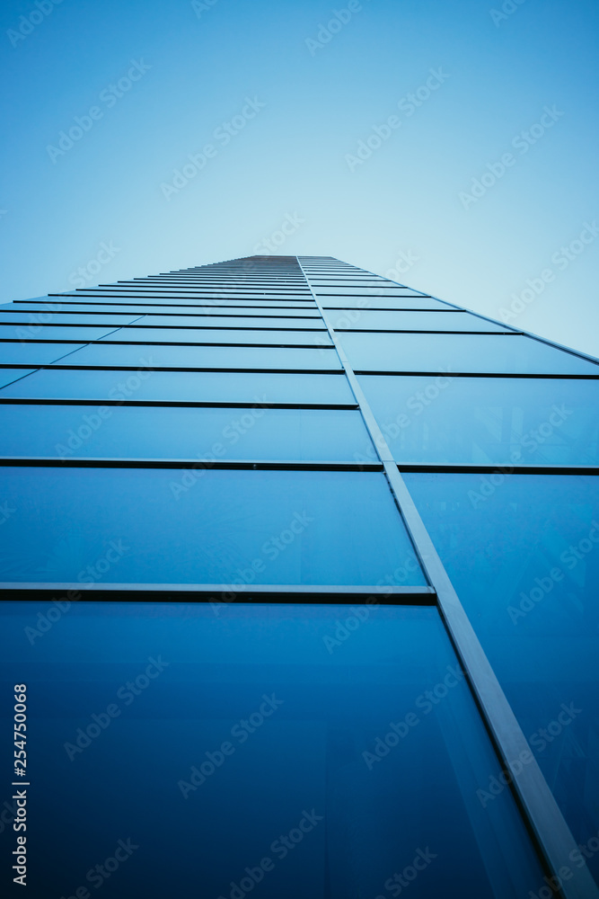 Modern skyscraper out of glass and blue sky Modern skyscraper out of glass and blue sky