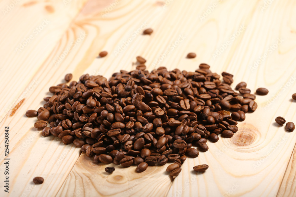coffee beans on wooden background coffee beans on wooden background